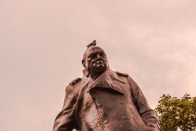 Low angle view of statue against sky