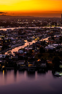 High angle view of illuminated buildings in city at night