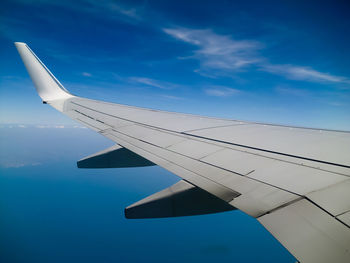 Low angle view of airplane flying in sky