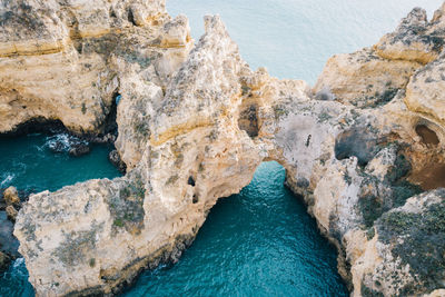 High angle view of rock formations in sea