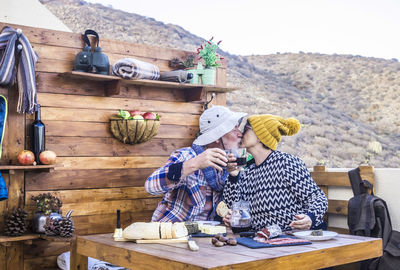 People sitting on table at outdoor cafe