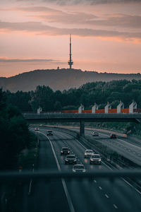 German autobahn a2 at sunset with cars and the bielefeld television tower in the background