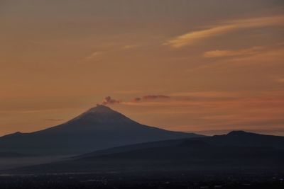Scenic view of mountains against sky during sunset