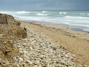 Scenic view of beach against sky