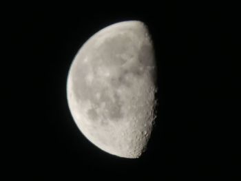 Low angle view of moon against clear sky at night