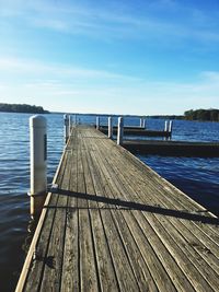 Pier over sea against sky