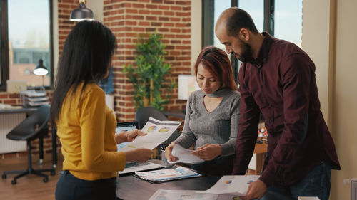 Business colleagues working at office