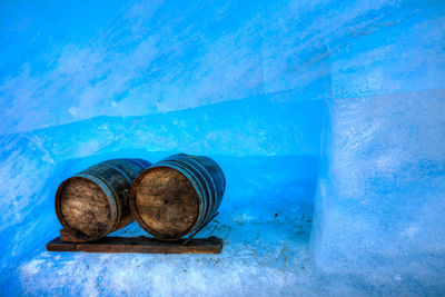 High angle view of drink on blue wall