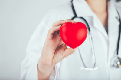 Close-up of hand holding heart shape