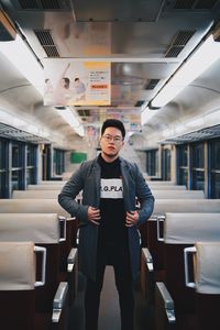 Portrait of man standing in bus