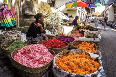 Man for sale at market stall