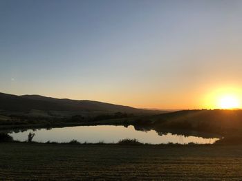 Scenic view of landscape against sky during sunset