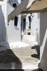 White building by staircase on sunny day