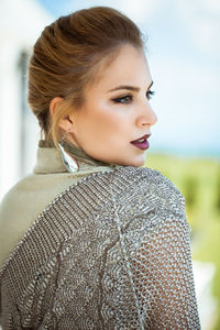 Portrait of young woman looking away