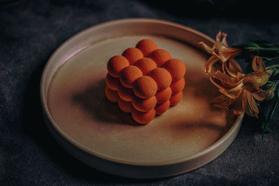 High angle view of fruits in plate on table