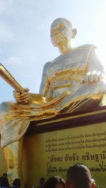 Low angle view of statue against sky