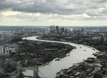 High angle view of river and buildings in city