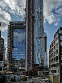 Modern buildings in city against sky