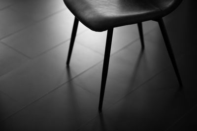 Empty chair on tiled floor