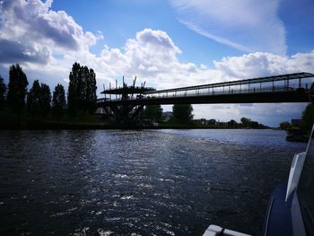 Bridge over river against sky