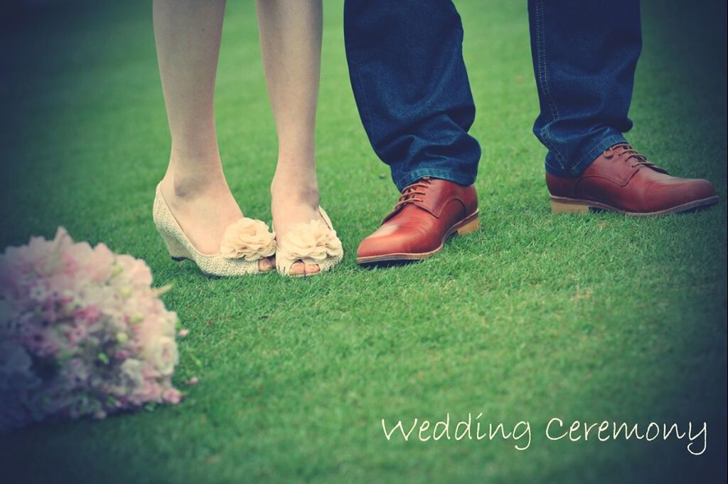 low section, person, grass, shoe, field, lifestyles, footwear, standing, men, leisure activity, human foot, grassy, unrecognizable person, green color, part of, outdoors