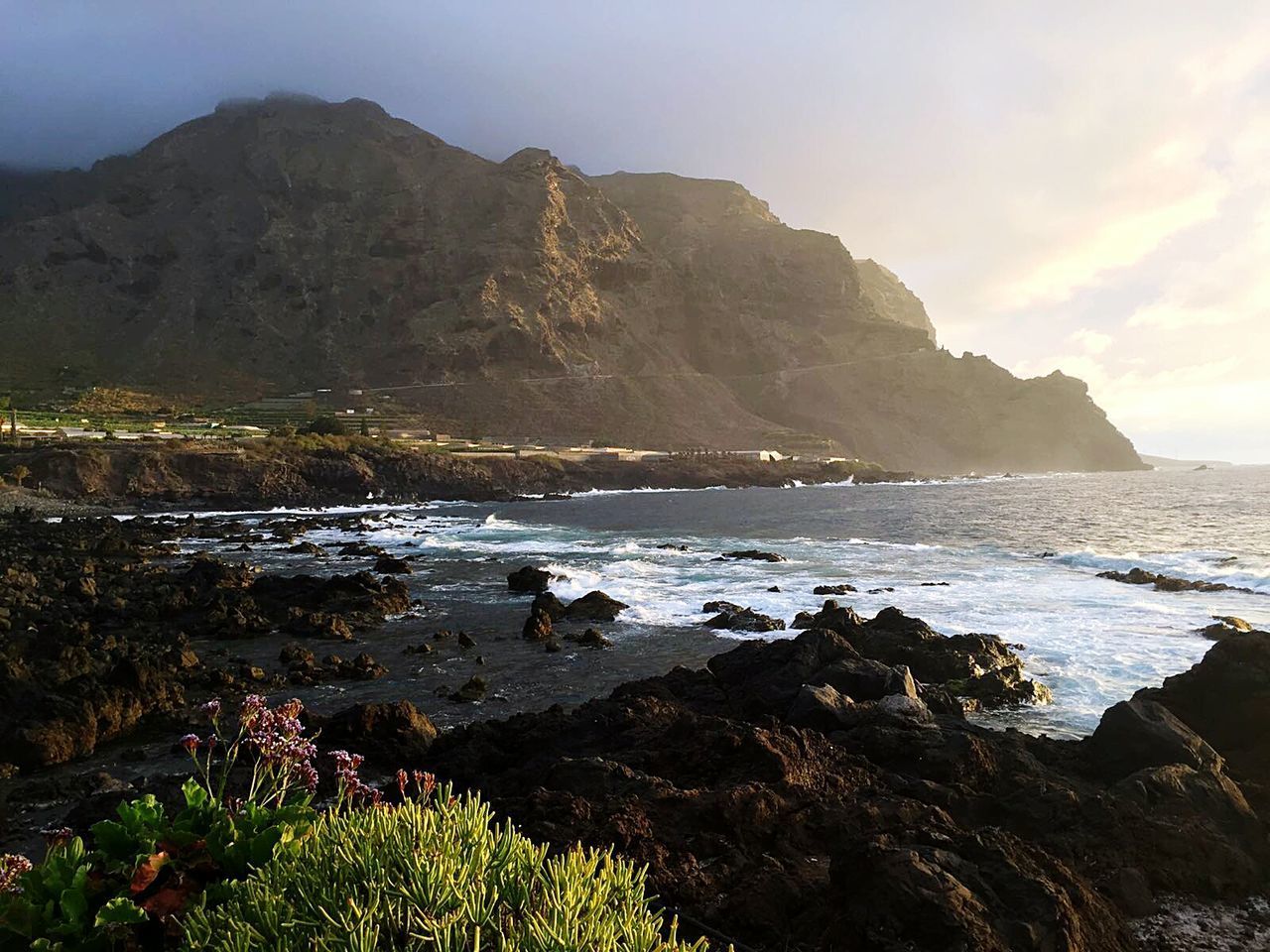 SCENIC VIEW OF SEA AND MOUNTAINS