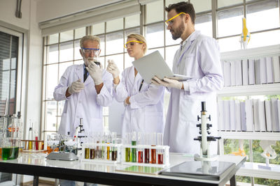 Scientists discussing at laboratory