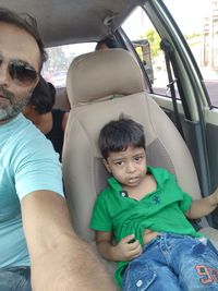 Portrait of boy sitting in car
