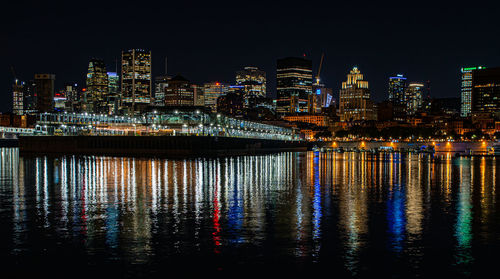 Illuminated modern buildings in city at night