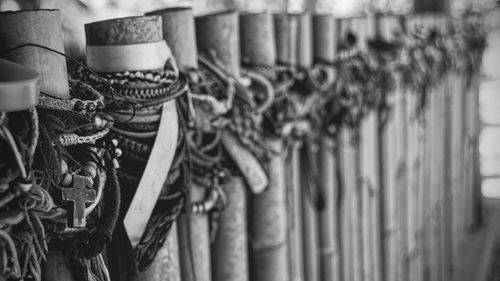 Close-up of bracelets on wooden fence