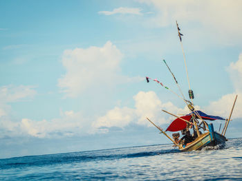 Ship in sea against sky