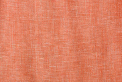 Orange cotton linen background, textile cloth concept