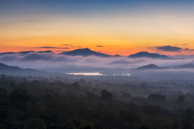 Scenic view of mountains against sky during sunset