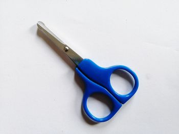 High angle view of blue paint on table against white background