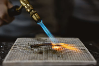 Cropped hand of man working on table