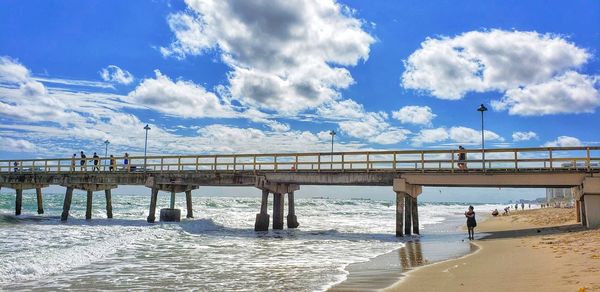 Bridge over sea against sky