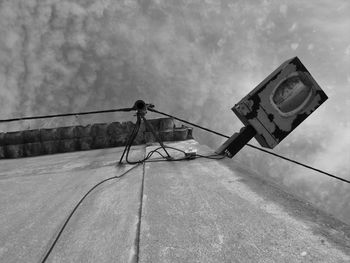 Low angle view of camera against sky