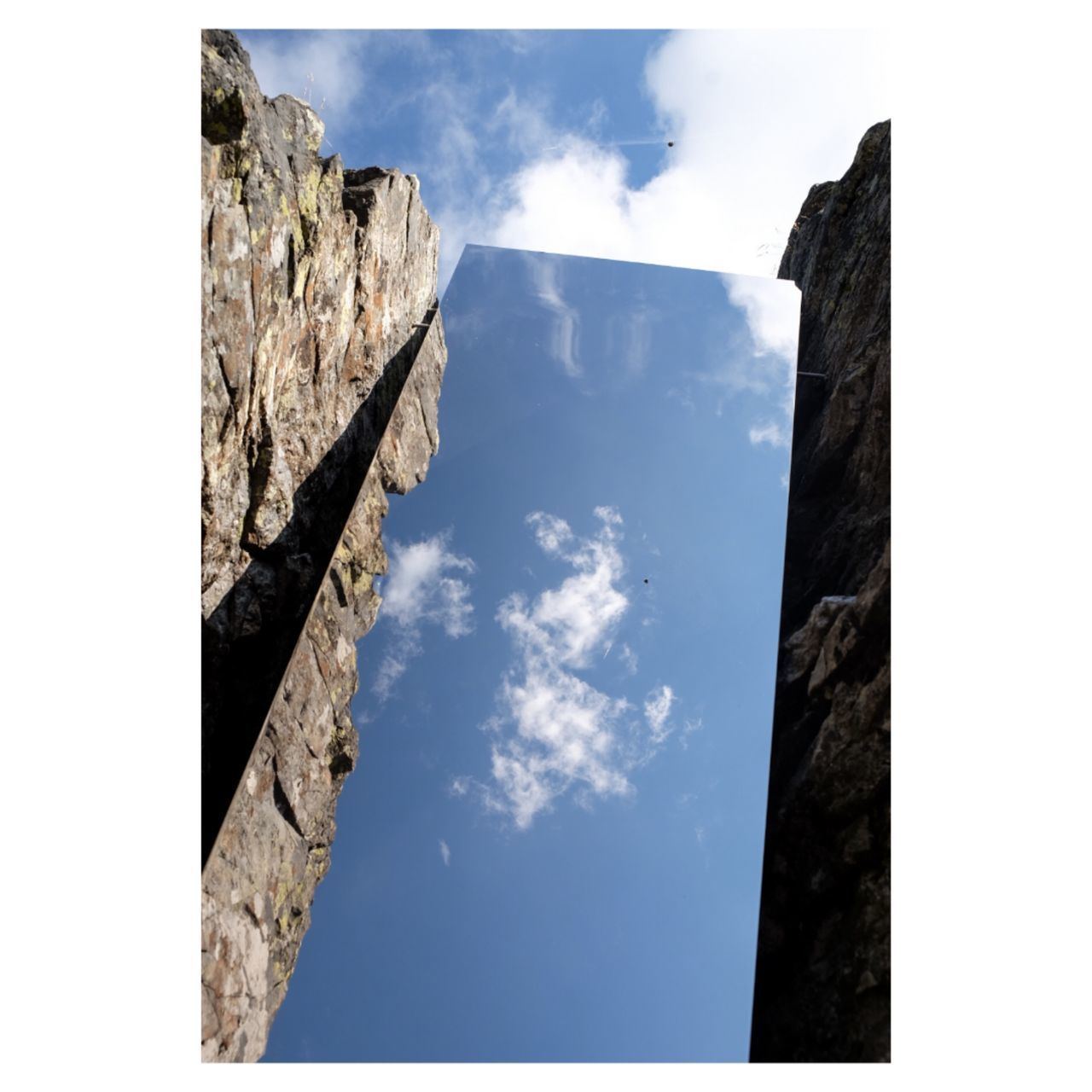 LOW ANGLE VIEW OF WALL AGAINST SKY