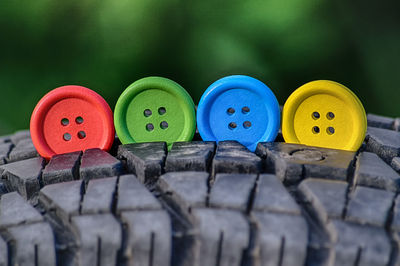 Close-up of colorful buttons on tire