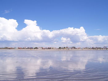 Scenic view of sea against blue sky