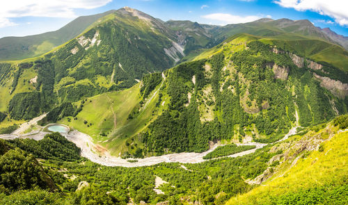 Scenic view of landscape and mountains against sky
