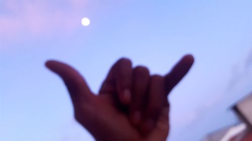 Close-up of hand against clear sky