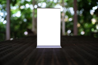 Empty placard on table at home