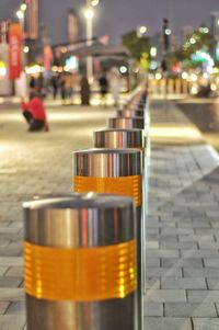 Close-up of illuminated lights on street at night