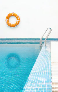 View of swimming pool against clear blue sky