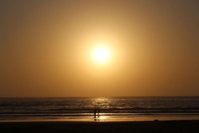 Scenic view of sea against clear sky during sunset