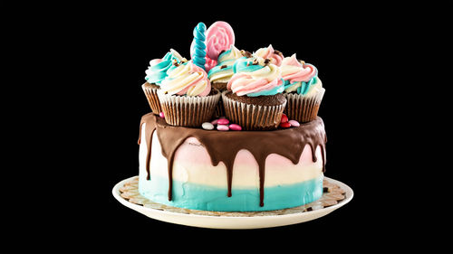 Close-up of cupcakes against black background