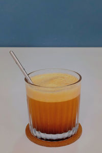 Close-up of drink against white background