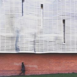 Woman standing against wall