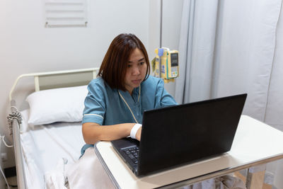 Young woman using mobile phone